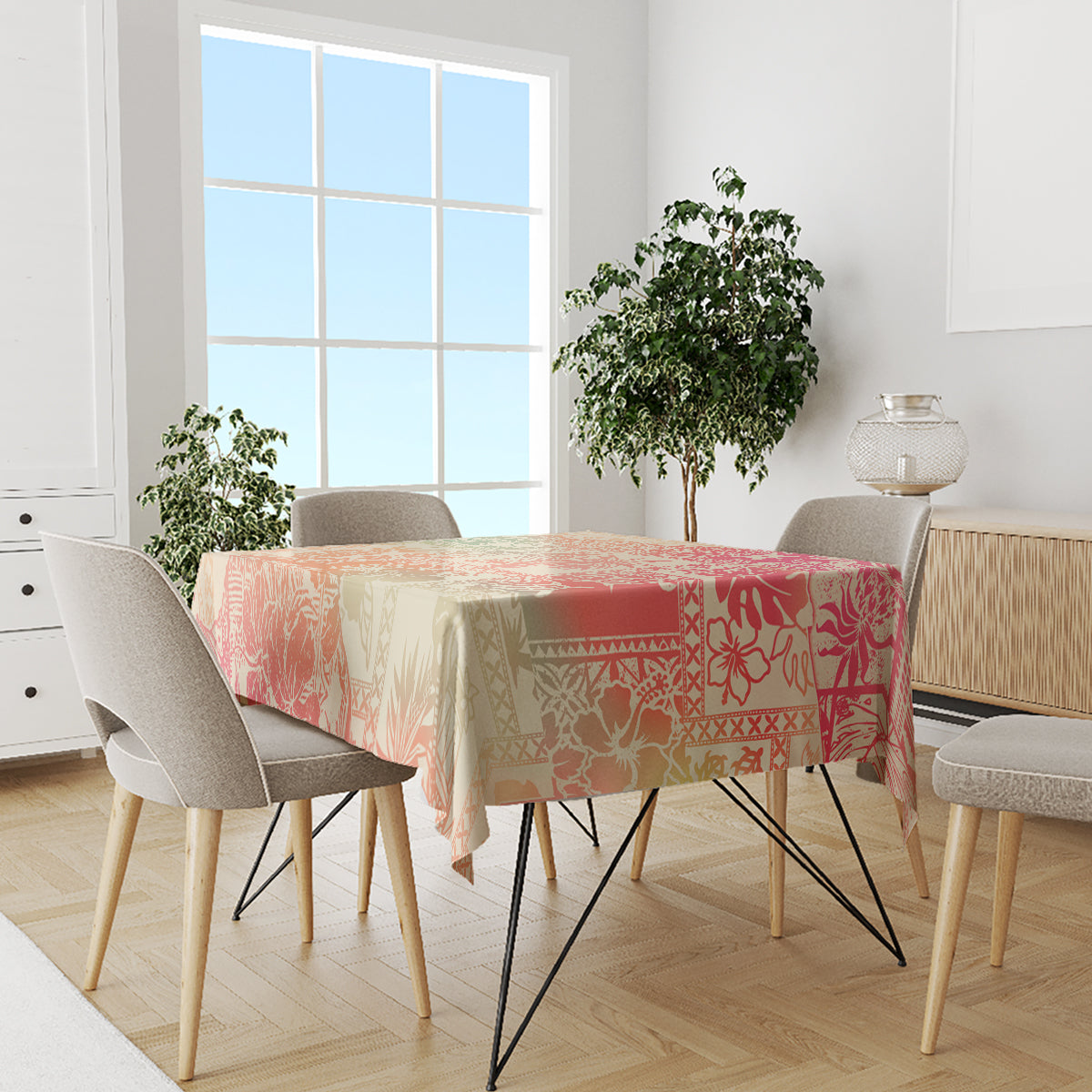 Hawaii tablecloth on dining table with pink, orange, and cream tropical print