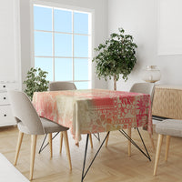 Hawaii tablecloth on dining table with pink, orange, and cream tropical print