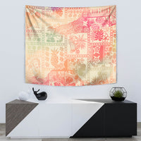 Wall-hanging tapestry in pink ombre with repeating tribal blocks and floral motifs