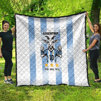 Argentina quilt blanket spread outdoors: white base, light blue vertical stripes, goat 10 crest