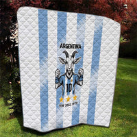 Folded Argentina quilt blanket with white diamond quilting and light blue stripe bands, goat graphic