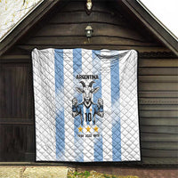 Hanging Argentina quilt blanket indoors: white quilted fabric with light blue stripes and goat emblem