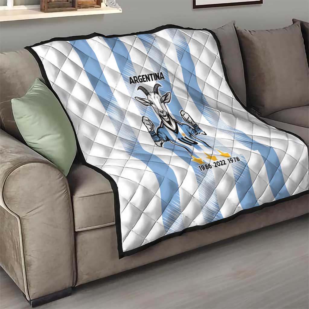 Argentina quilt blanket on sofa: white diamond quilting with light blue diagonal stripes and goat 10