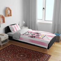 Pink Argentina goat bedding set on bed with striped duvet and pillowcases, goat 10 stars