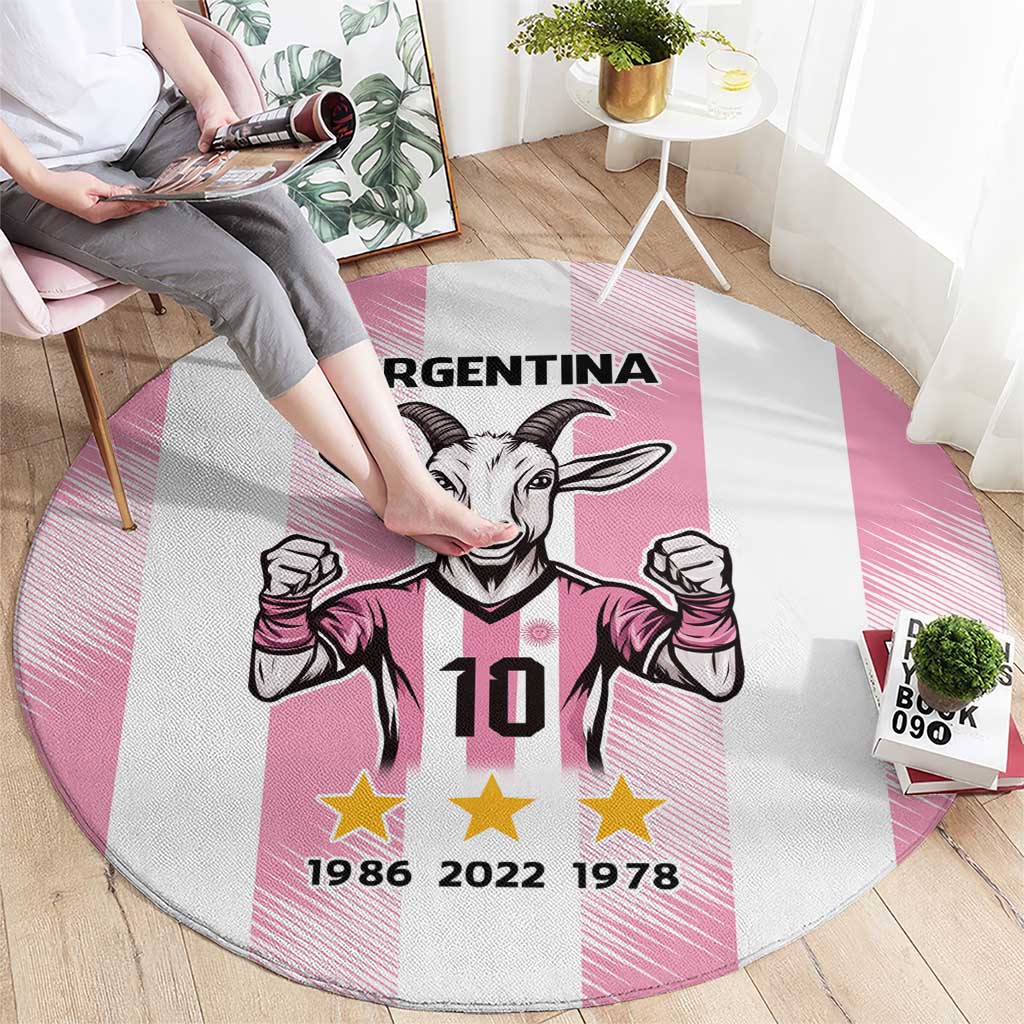 Pink round Argentina goat graphic carpet with raised fists, '10', and 1986 2022 1978