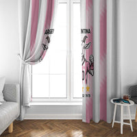 Pink window curtain with Argentina goat print on vertical striped panels by a window