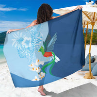 Blue bird-and-flower sarong wrap with quetzal-style print and flowing drape