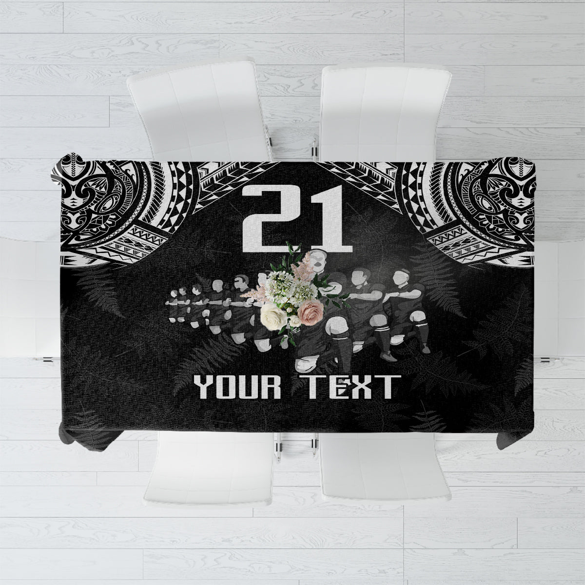 Black custom tablecloth with Kapa-style border, large '21' and floral centerpiece