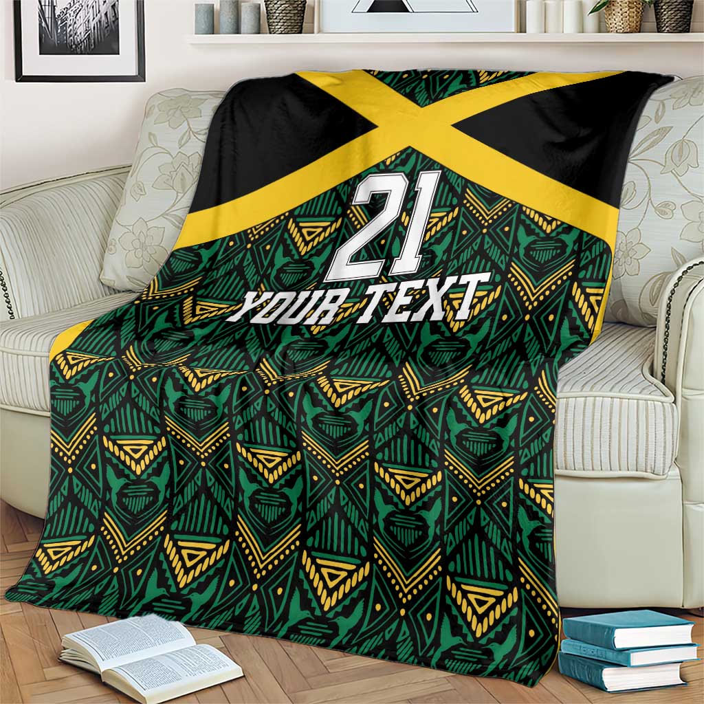 Custom football blanket on sofa, black border, yellow X, green geometric motifs, '21 Your Text'.