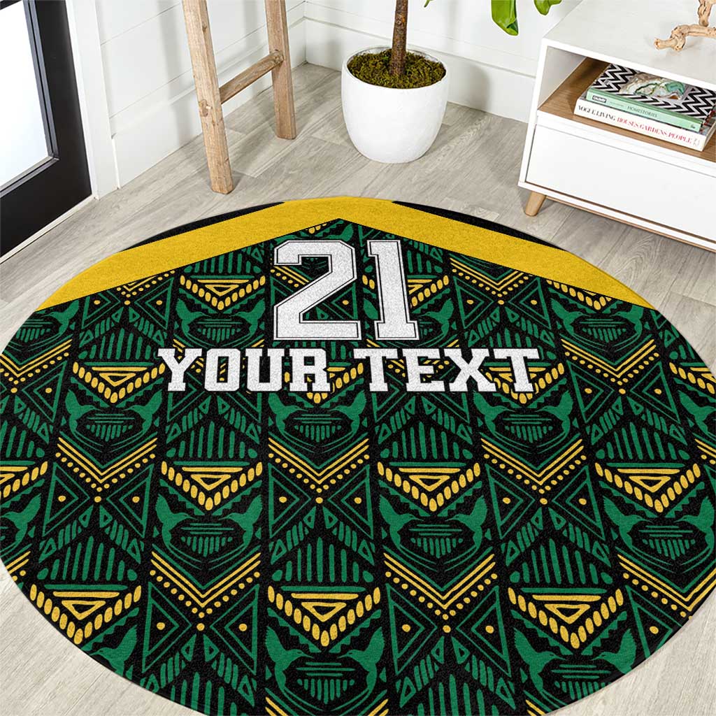 Round carpet on black base with green/yellow ethnic motifs and 'YOUR TEXT' print