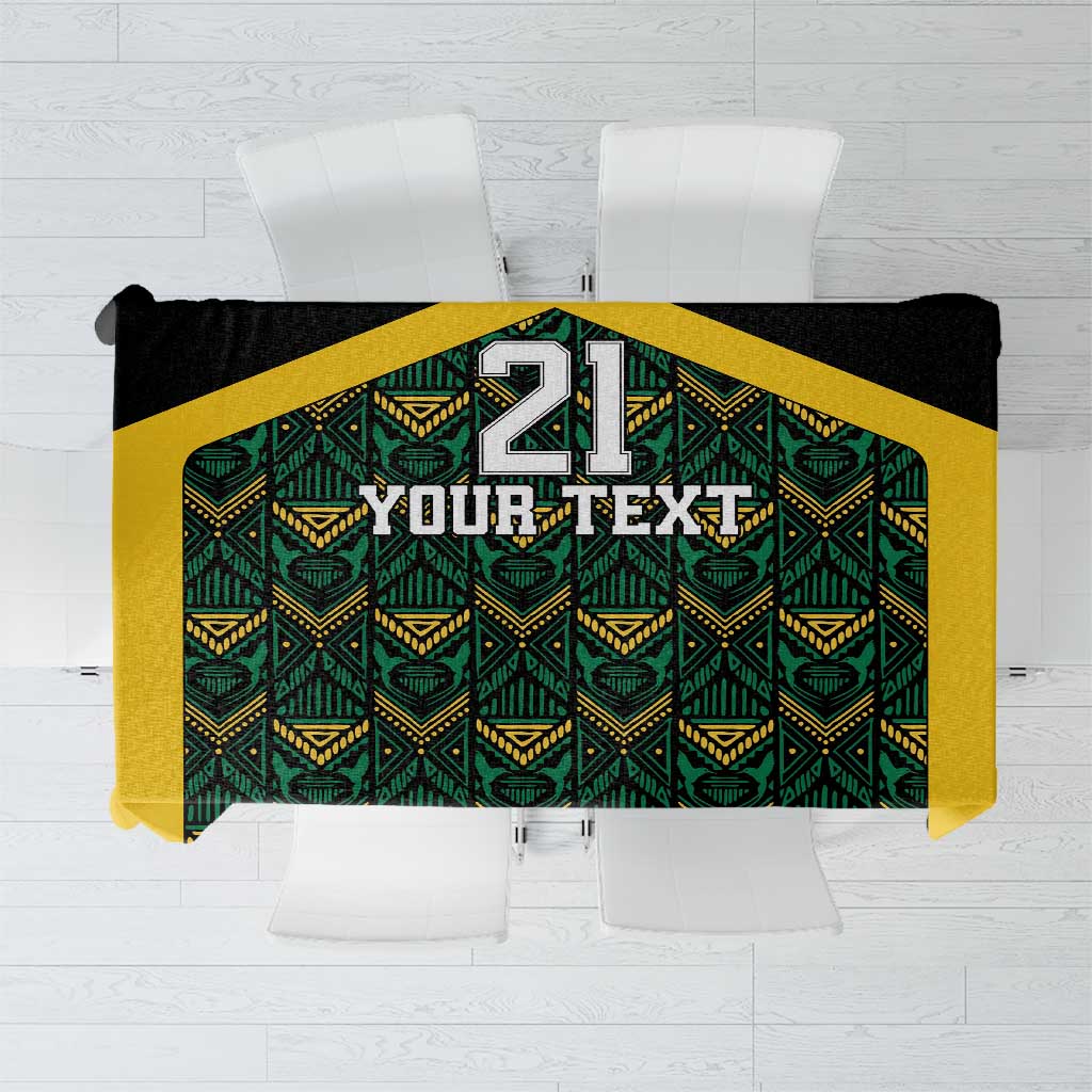 Black tablecloth with green and gold geometric ethnic motifs, custom panel with large 21 design.