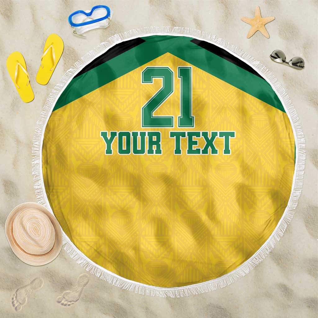 Round beach blanket with gold-yellow fabric, green border, fringe edge, “Your Text” and 21