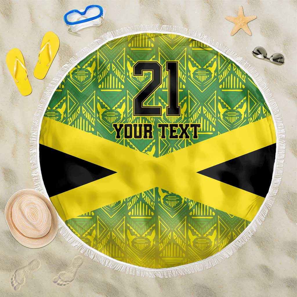 Round beach blanket with fringe, green pattern and yellow Jamaican cross, “21” and “Your Text”