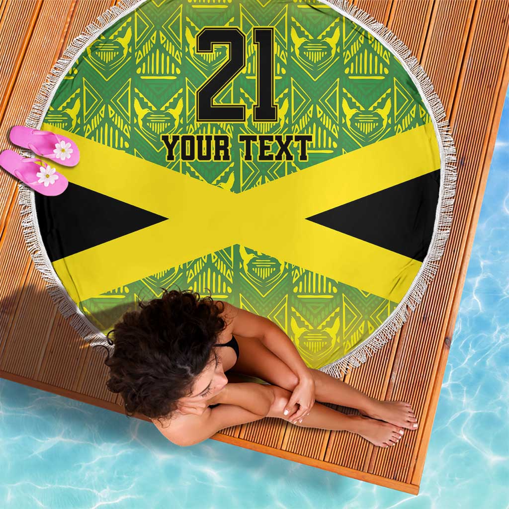 Round beach blanket with fringe, green pattern and yellow Jamaican cross, “21” and “Your Text”
