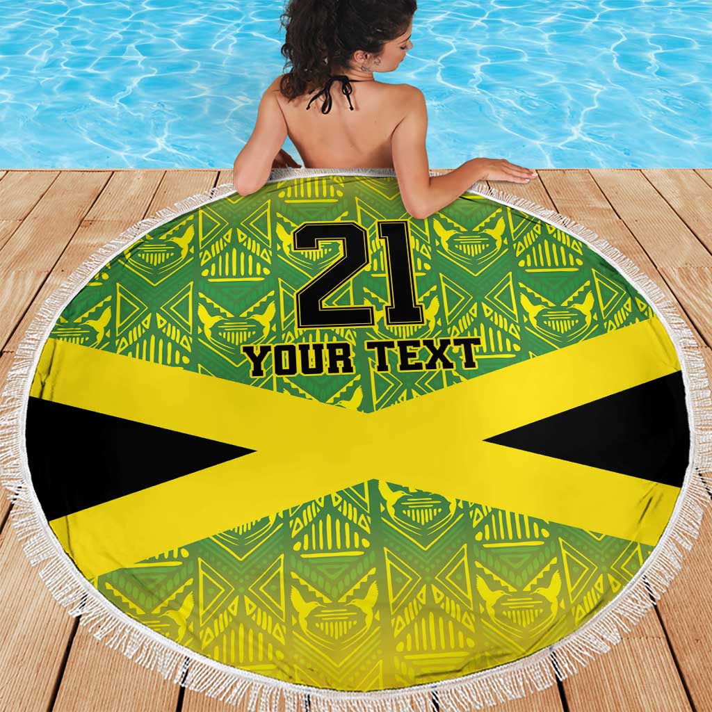 Round beach blanket with fringe, green pattern and yellow Jamaican cross, “21” and “Your Text”