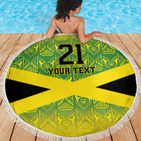 Round beach blanket with fringe, green pattern and yellow Jamaican cross, “21” and “Your Text”