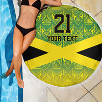 Round beach blanket with fringe, green pattern and yellow Jamaican cross, “21” and “Your Text”