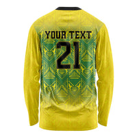 Gold long-sleeve shirt back with green geometric pattern and custom number graphic