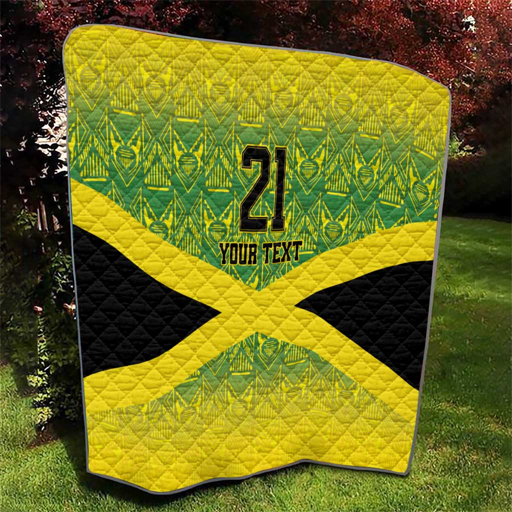 Outdoor quilt with green geometric background, yellow X cross over black, "21" and "YOUR TEXT".