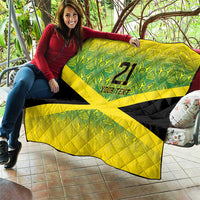 Yellow and black quilt with green patterned top and bold X, "21" and "YOUR TEXT" text.
