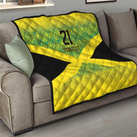 Living room quilt on sofa: green geometric top, yellow X, black trim, "21" and "YOUR TEXT".