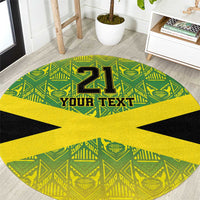 Round area rug with green, yellow, and black geometric print and large “21” with “YOUR TEXT”