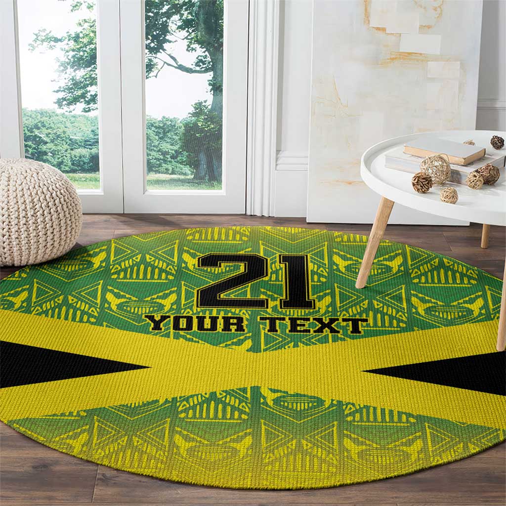 Round reggae-style area rug, green and yellow geometric pattern with black star and “YOUR TEXT”