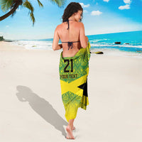 Lime green geometric sarong with black and yellow diagonal stripes, '21' and 'Your Text' draped