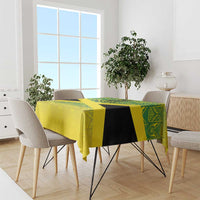 Custom gold tablecloth with green geometric reggae pattern, draped on table
