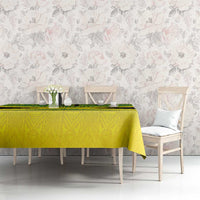Custom gold tablecloth with green geometric reggae pattern, set on dining table