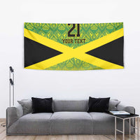 Wall tapestry featuring green and yellow patterned design with black Jamaican flag X and 21