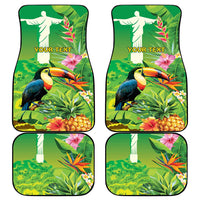 Set of four green tropical car mats with toucans, pineapples, and 'YOUR TEXT' panels.