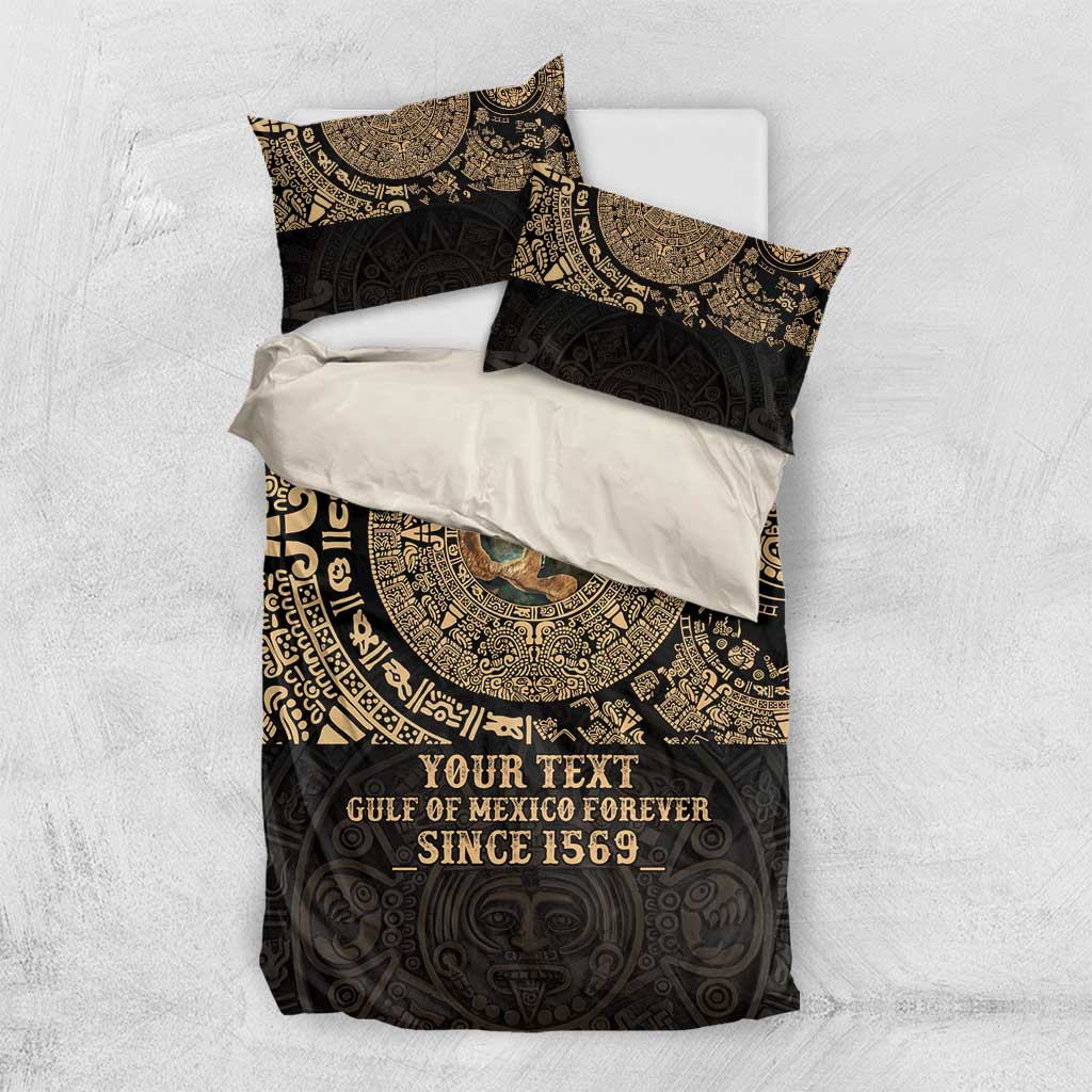 Flat-lay black duvet bedding set with gold Aztec pattern and two pillowcases