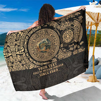Black sarong with ornate gold circular medallion and vintage lettering, fringeless hem