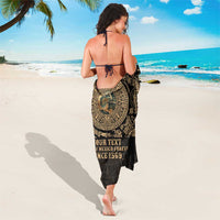 Black sarong with gold circular print and visible text 'Since 1569', wrap cover