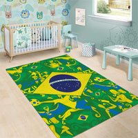 Green area rug with yellow border and blue circular emblem, featuring animal-themed silhouettes