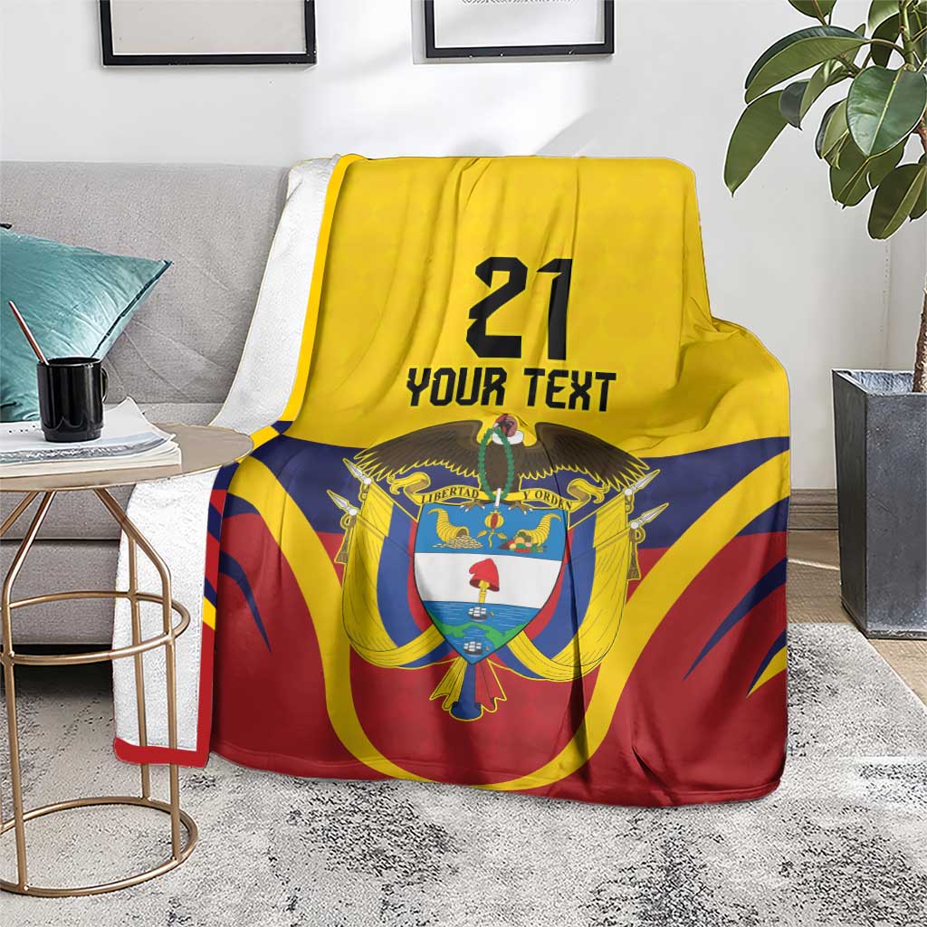 Custom flag blanket with '21' and 'YOUR TEXT' featuring Colombia emblem, draped on chair