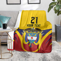 Custom flag blanket with '21' and 'YOUR TEXT' featuring Colombia emblem, draped on chair