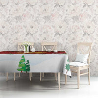 Christmas tablecloth, light blue base with pine tree prints and red stripe edge