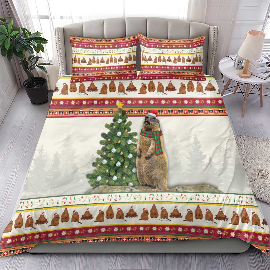 Christmas bedding set on bed: white comforter with red striping, dog in scarf, pine tree print