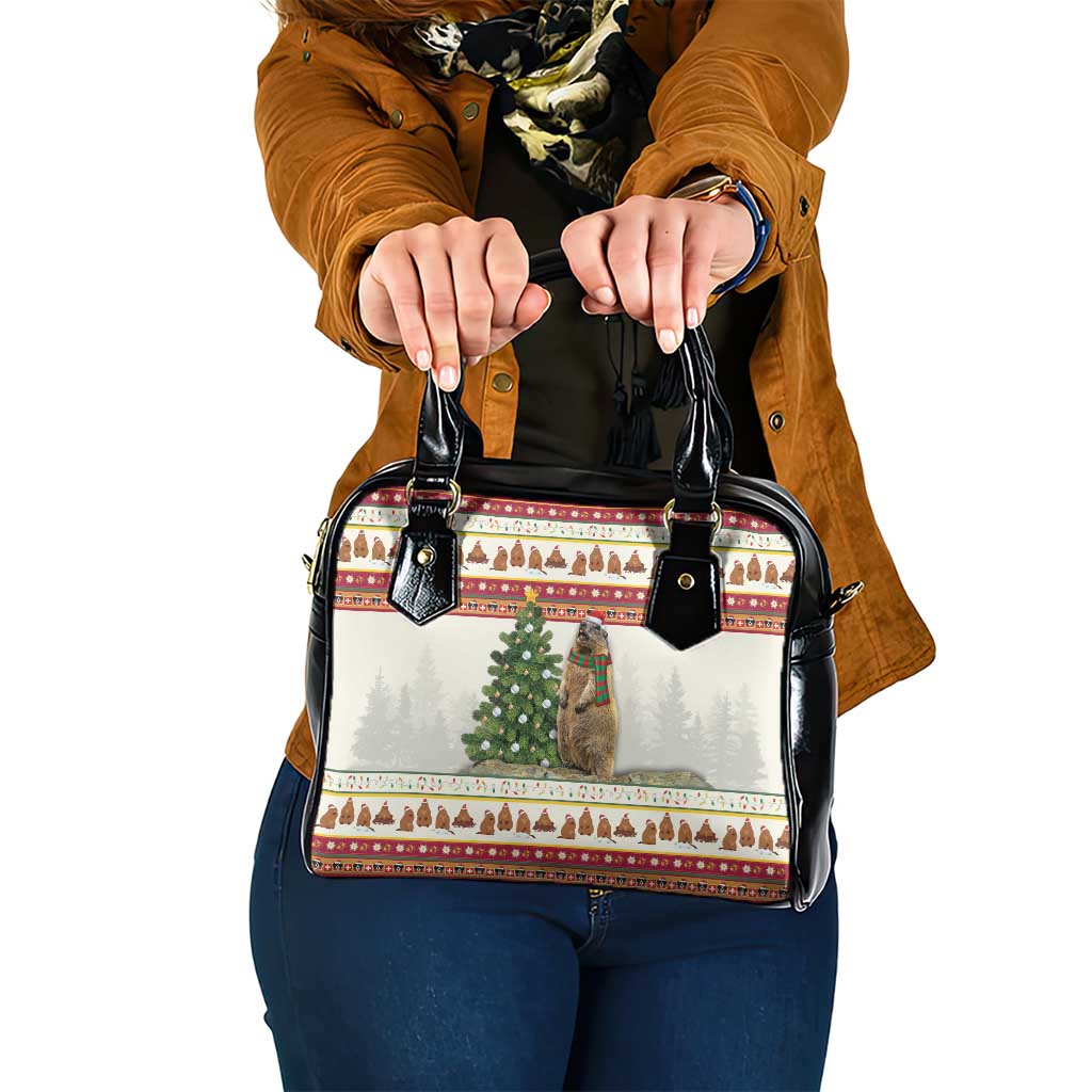 Black shoulder handbag with holiday village print, double top handles and black trim