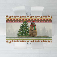 Red Christmas tablecloth with cow, evergreen tree, and holiday border pattern