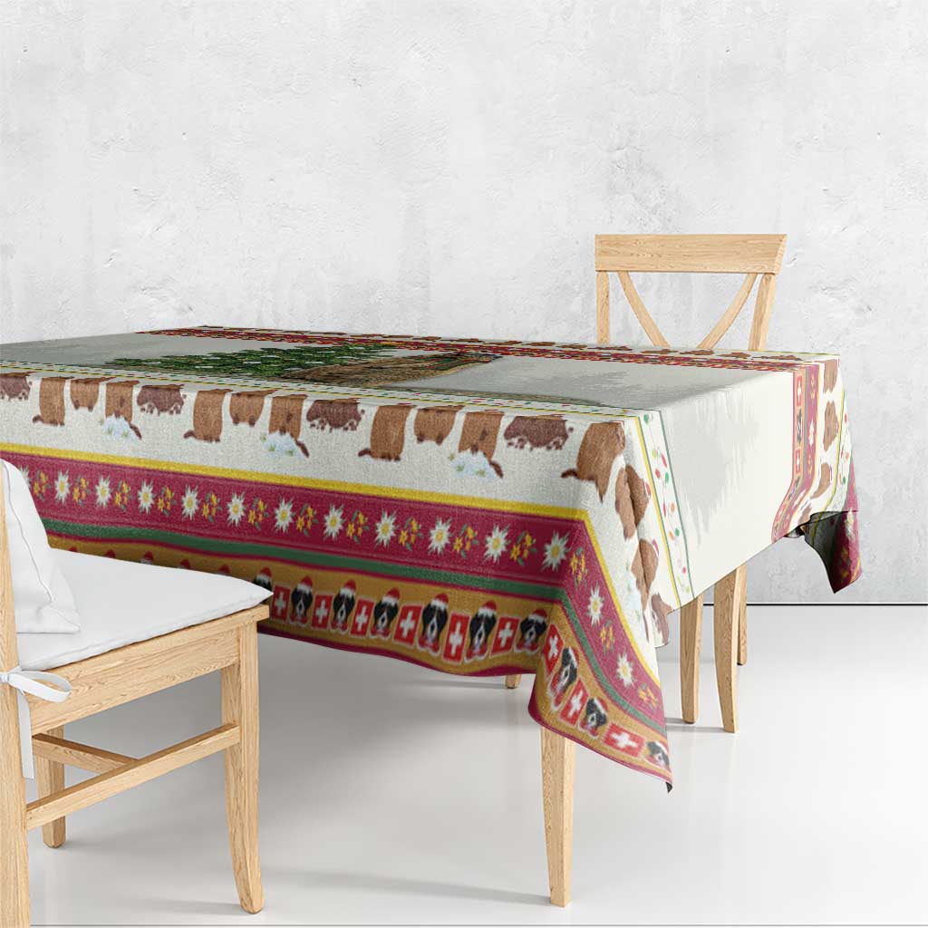 Red-trimmed cow themed Christmas tablecloth draped over table edge