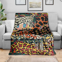 Wild animal skins blanket with vivid multicolor graphics, spread over a gray sofa