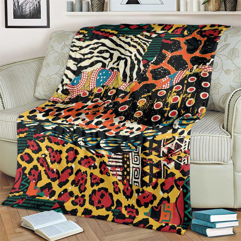 Colorful wild animal print blanket with bold geometric borders, laid over a cream armchair