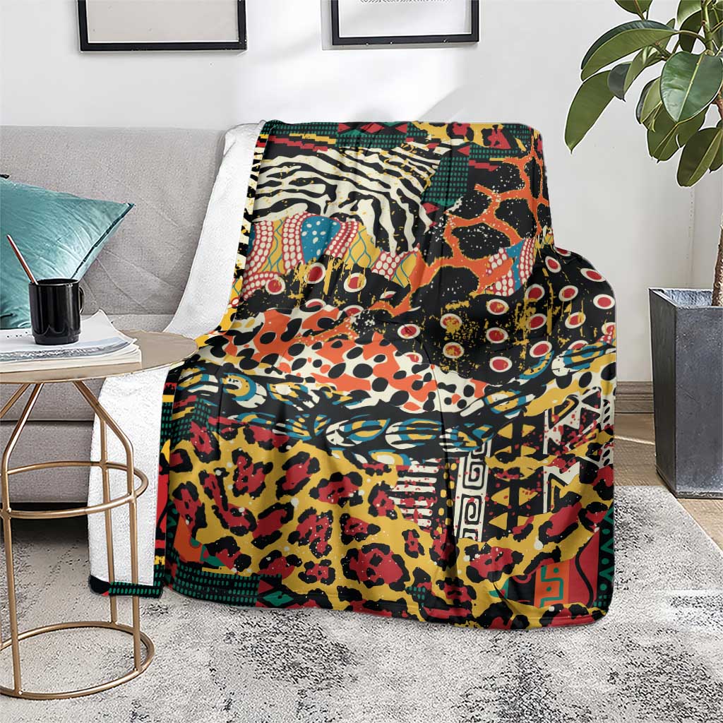 Vivid multicolor wild animal skins blanket draped on a gray couch with books nearby