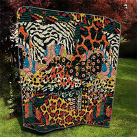 Wild animal skins quilt featuring zebra, giraffe, and spotted animal collage on multicolor