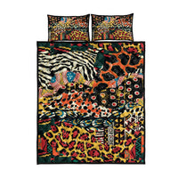 Patchwork animal print quilt with two pillow shams on a black ground