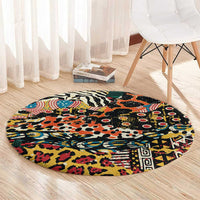 Round black rug with colorful wild animal pattern, including red, teal, orange, and yellow