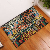 Rectangular rubber doormat with bright wild animal collage pattern in black, cream, teal, orange